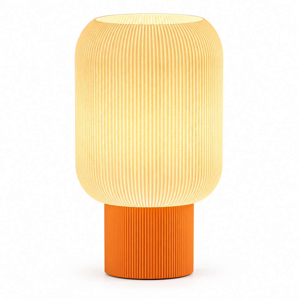 Modern table lamp with a rounded white ribbed shade and cylindrical orange base