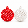 Red and white Christmas baubles with an open spiral design; examples from a set of nine