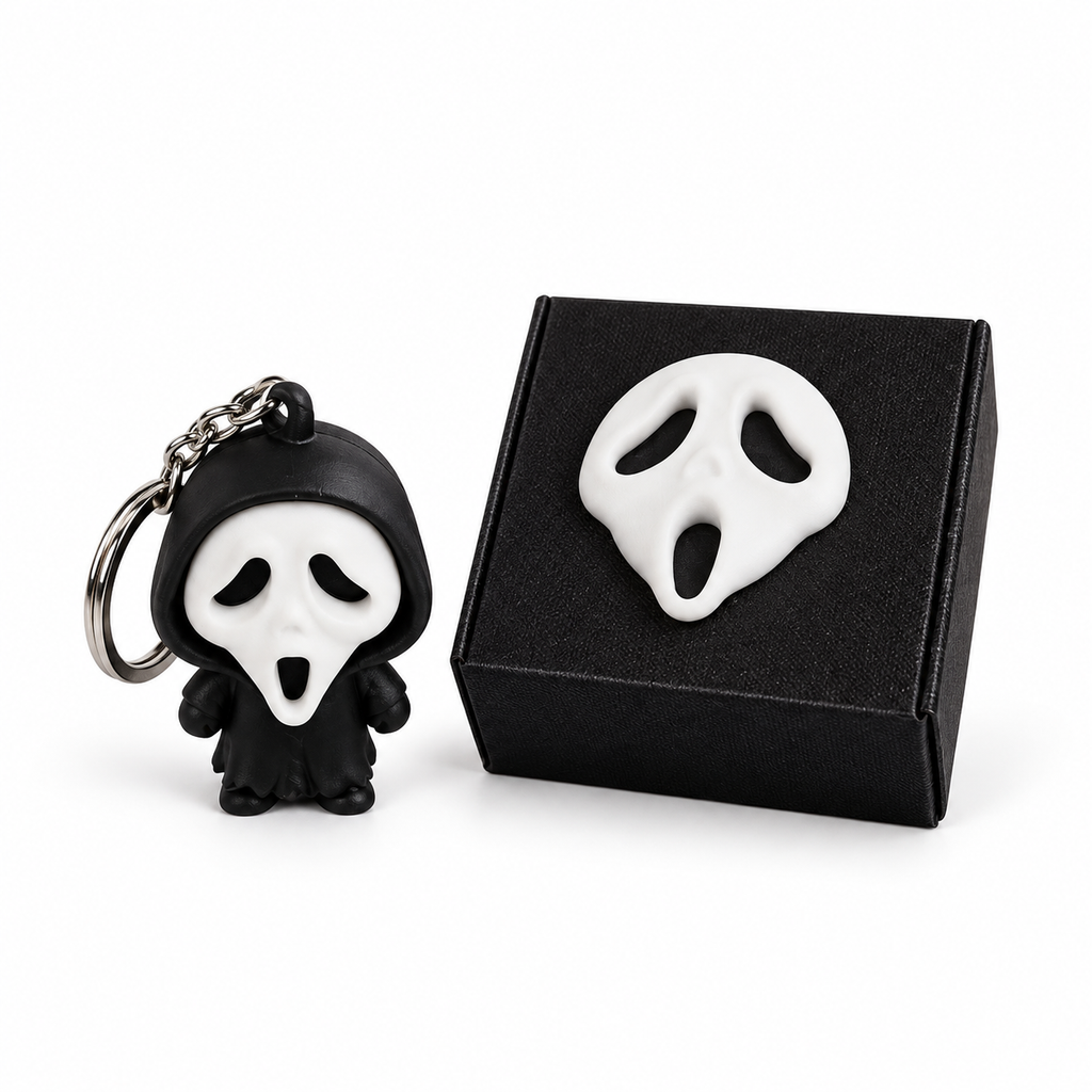 Ghost-face character keychain beside its matching black personalised gift box
