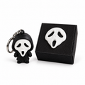 Ghost-face character keychain beside its matching black personalised gift box