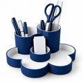 Navy ribbed cloud-shaped desk organiser holding pens, scissors, ruler and notes