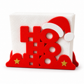 Red Ho Ho Ho Christmas napkin holder with white Santa hat trim and gold star details
