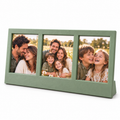 Triple photo tabletop frame displayed on a wooden table