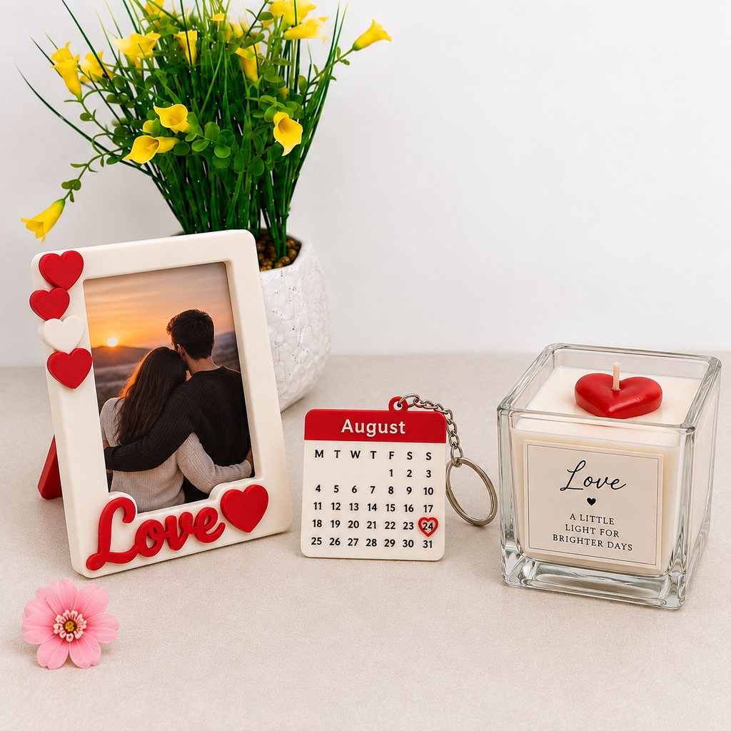Valentine's Day gift kit with Love photo frame, calendar date keychain and Love scented candle on white background