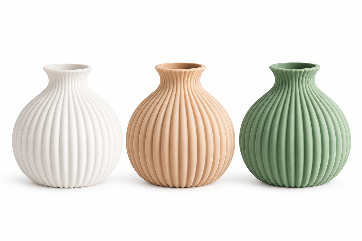 Set of three ribbed decorative vases in white, beige and sage on a white background
