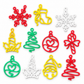 Colourful openwork Christmas ornaments in red, yellow, green and white